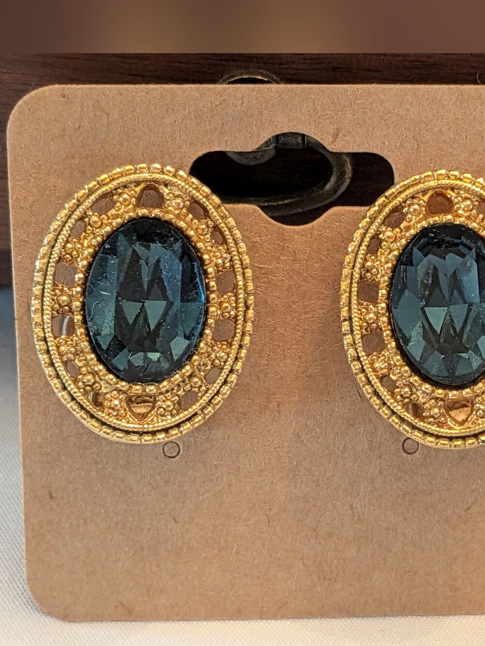 Gold-Tone Oval Clip On Earrings with Dark Teal Faceted Stone